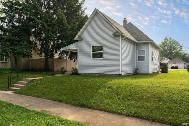 115 S 27th St, Lafayette, IN 47904 - view of home's exterior featuring a chimney and a shingled roof