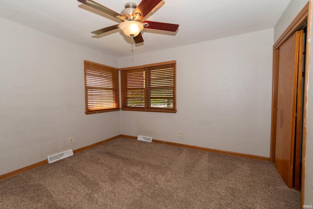 18655 Cleveland Rd, South Bend, IN 46637 - unfurnished bedroom featuring carpet, a closet, and ceiling fan