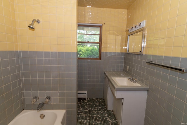 18655 Cleveland Rd, South Bend, IN 46637 - bathroom featuring tile walls, a bath, vanity, and baseboard heating