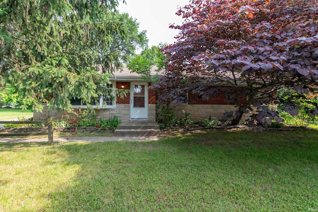 18655 Cleveland Rd, South Bend, IN 46637 - obstructed view of property featuring a front yard and brick siding