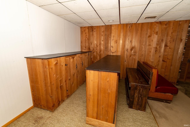 18655 Cleveland Rd, South Bend, IN 46637 - indoor dry bar with wood walls, light carpet, and a drop ceiling