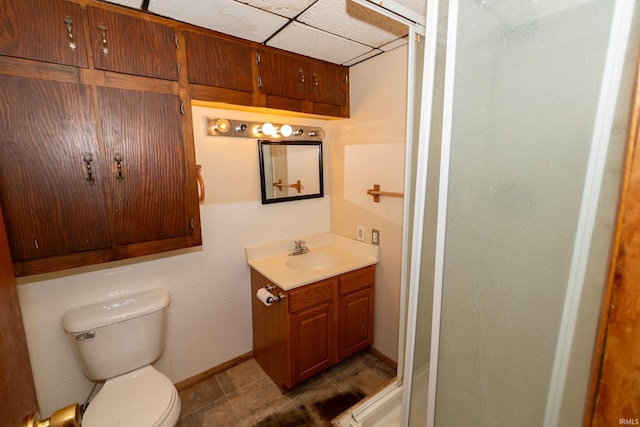 18655 Cleveland Rd, South Bend, IN 46637 - bathroom with vanity, a shower stall, a drop ceiling, and tile patterned floors
