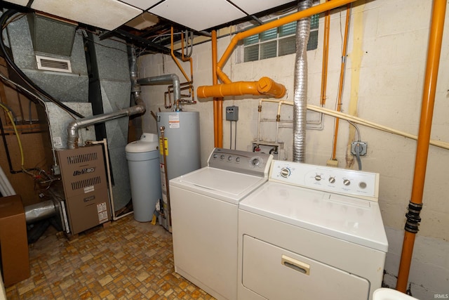 18655 Cleveland Rd, South Bend, IN 46637 - laundry area with water heater and washing machine and clothes dryer