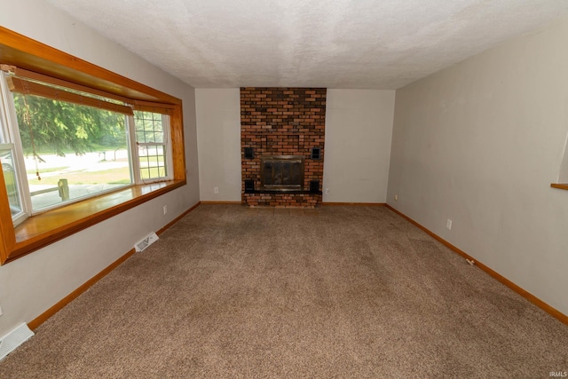 18655 Cleveland Rd, South Bend, IN 46637 - unfurnished living room featuring carpet floors, a brick fireplace, and a textured ceiling