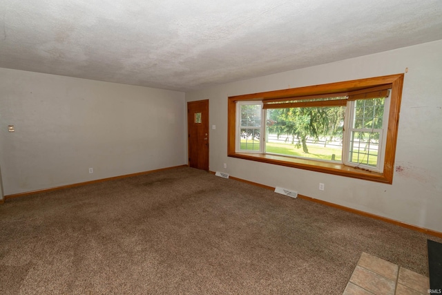 18655 Cleveland Rd, South Bend, IN 46637 - spare room featuring carpet and a textured ceiling