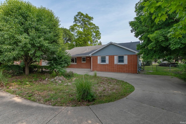 18633 Cleveland Rd, South Bend, IN 46637 - ranch-style home featuring curved driveway and brick siding