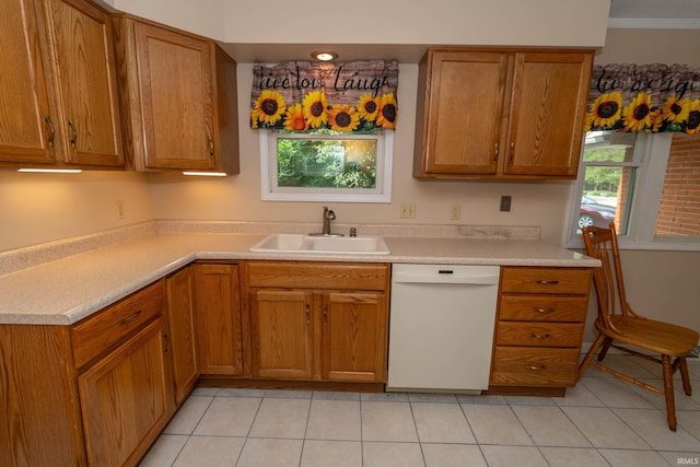 18633 Cleveland Rd, South Bend, IN 46637 - kitchen with white dishwasher, healthy amount of natural light, and brown cabinets