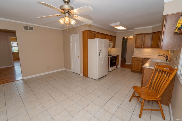18633 Cleveland Rd, South Bend, IN 46637 - kitchen featuring white appliances, brown cabinets, light countertops, a ceiling fan, and ornamental molding