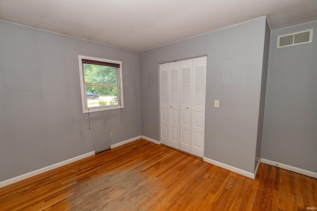 18633 Cleveland Rd, South Bend, IN 46637 - unfurnished bedroom featuring light wood-type flooring and a closet