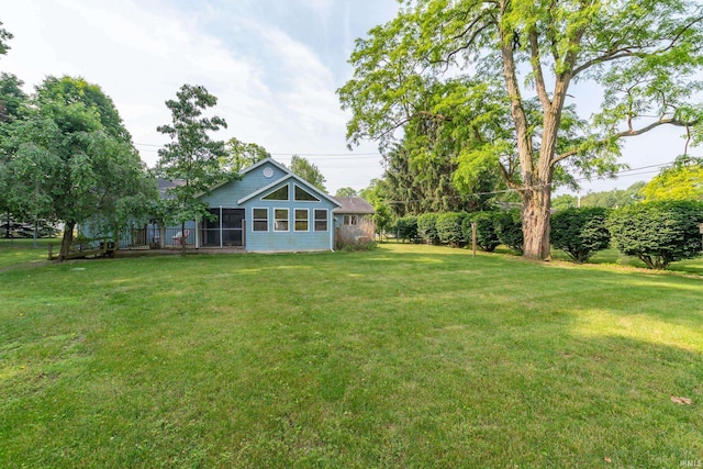 18633 Cleveland Rd, South Bend, IN 46637 - view of grassy yard featuring a sunroom