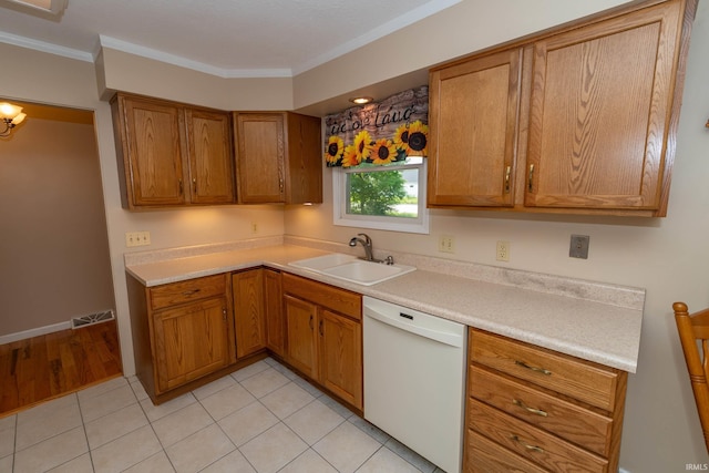 18633 Cleveland Rd, South Bend, IN 46637 - kitchen with dishwasher, brown cabinets, crown molding, light countertops, and light tile patterned flooring