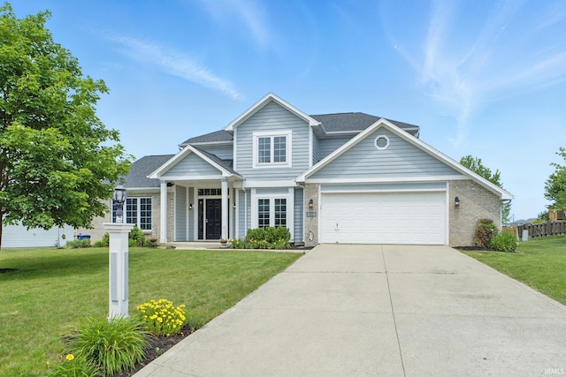 14628 Firethorne Path, Fort Wayne, IN 46814 - traditional-style house with a front lawn, driveway, a garage, and a shingled roof