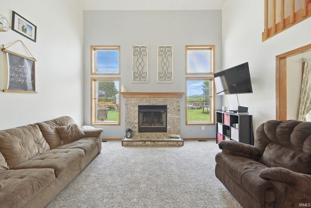 14628 Firethorne Path, Fort Wayne, IN 46814 - living area with carpet, a high ceiling, and a fireplace