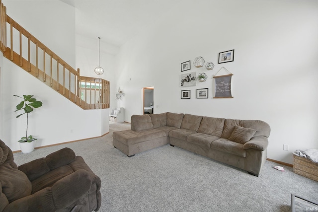 14628 Firethorne Path, Fort Wayne, IN 46814 - living room featuring carpet flooring, stairway, high vaulted ceiling, and a chandelier