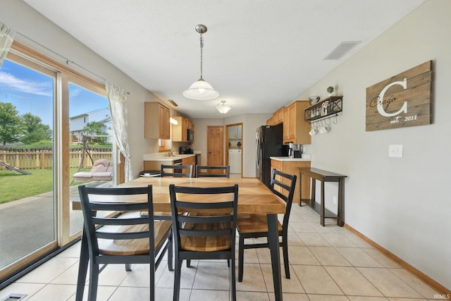 14628 Firethorne Path, Fort Wayne, IN 46814 - dining space with washer / dryer and light tile patterned flooring