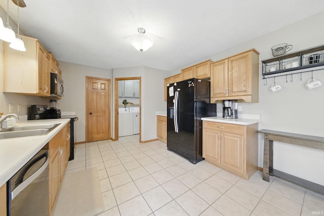 14628 Firethorne Path, Fort Wayne, IN 46814 - kitchen featuring black appliances, washer and clothes dryer, light countertops, light brown cabinets, and light tile patterned flooring