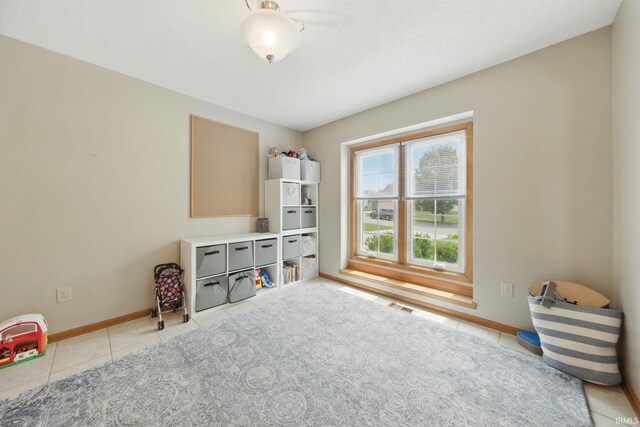14628 Firethorne Path, Fort Wayne, IN 46814 - game room featuring light tile patterned floors and baseboards