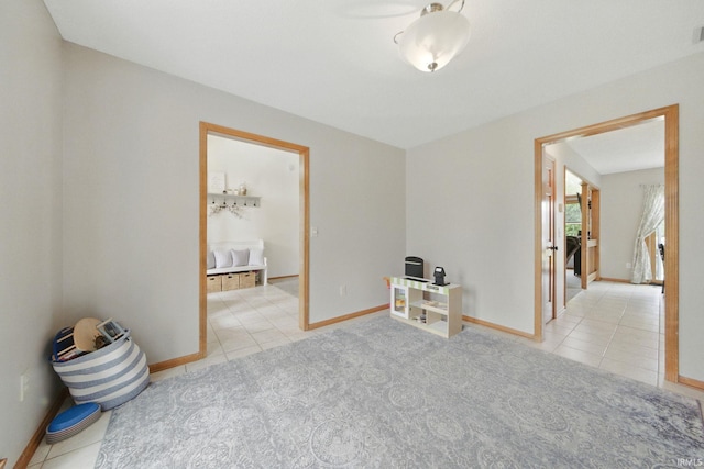 14628 Firethorne Path, Fort Wayne, IN 46814 - tiled empty room with baseboards