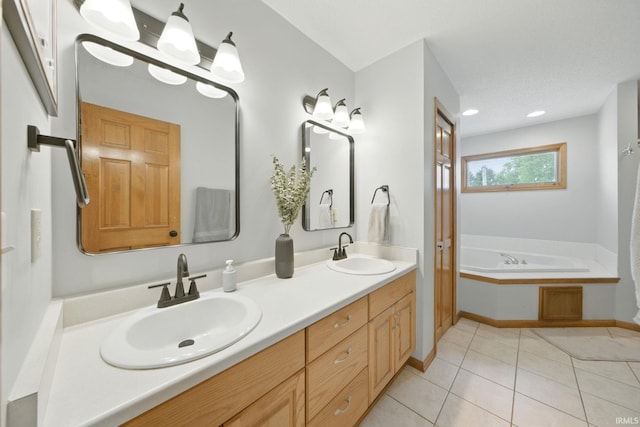 14628 Firethorne Path, Fort Wayne, IN 46814 - bathroom featuring double vanity, a bath, and tile patterned floors