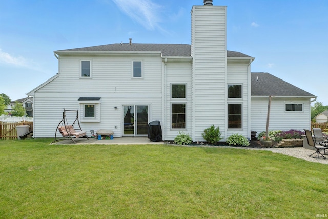 14628 Firethorne Path, Fort Wayne, IN 46814 - back of property with a patio, a chimney, and roof with shingles