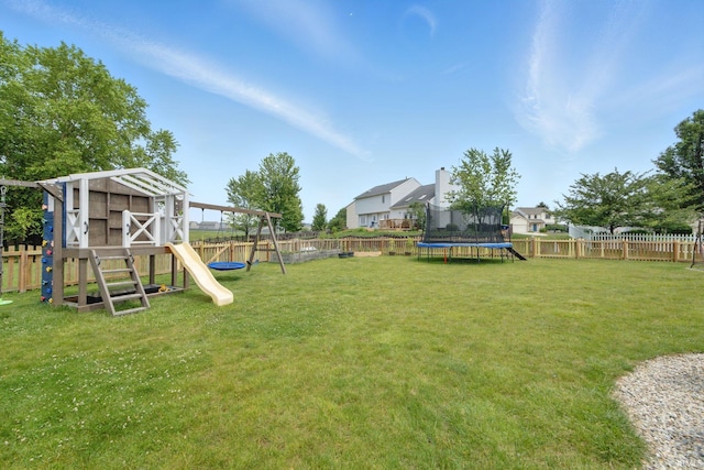 14628 Firethorne Path, Fort Wayne, IN 46814 - fenced backyard featuring a trampoline and a playground