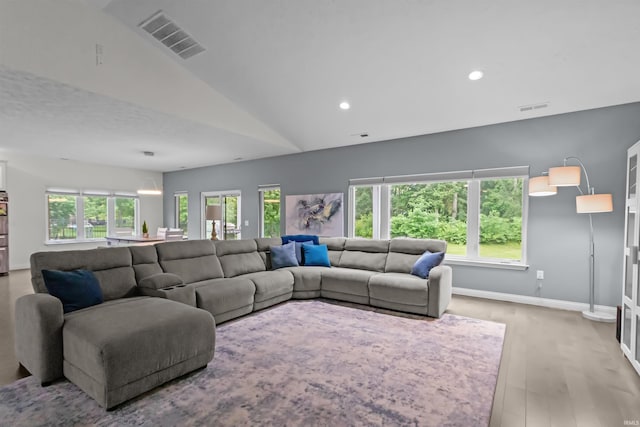 1014 Happy Hollow Rd, West Lafayette, IN 47906 - living room with plenty of natural light, light wood-style floors, vaulted ceiling, and recessed lighting
