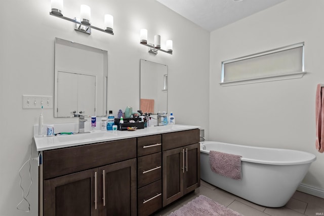 1014 Happy Hollow Rd, West Lafayette, IN 47906 - bathroom with double vanity, a freestanding bath, and tile patterned floors