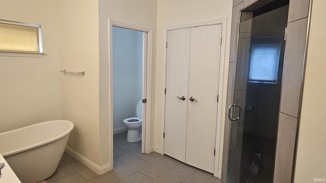 1014 Happy Hollow Rd, West Lafayette, IN 47906 - bathroom with tile patterned floors, a soaking tub, and a stall shower