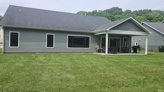 1014 Happy Hollow Rd, West Lafayette, IN 47906 - rear view of property featuring a patio area, a lawn, and a shingled roof