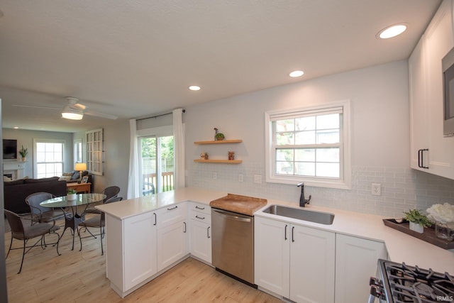 1914 Bayberry Ln, West Lafayette, IN 47906 - kitchen with appliances with stainless steel finishes, light countertops, a peninsula, light wood finished floors, and recessed lighting