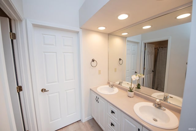1914 Bayberry Ln, West Lafayette, IN 47906 - full bath featuring double vanity, recessed lighting, and wood finished floors