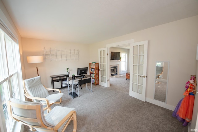 1914 Bayberry Ln, West Lafayette, IN 47906 - carpeted home office featuring french doors and a fireplace with flush hearth