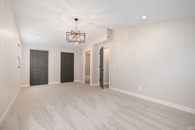 822 W Donaldson Ave, Mishawaka, IN 46545 - unfurnished room with a chandelier, light colored carpet, vaulted ceiling, and recessed lighting