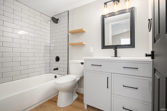 822 W Donaldson Ave, Mishawaka, IN 46545 - bathroom featuring wood finished floors, vanity, and shower / washtub combination