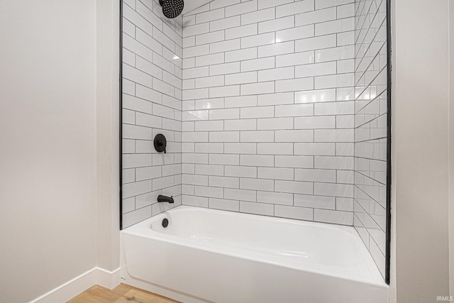 822 W Donaldson Ave, Mishawaka, IN 46545 - full bath featuring bathing tub / shower combination and wood finished floors
