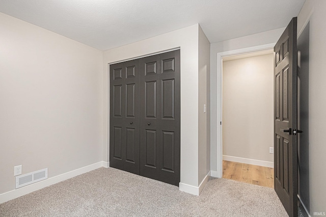 822 W Donaldson Ave, Mishawaka, IN 46545 - unfurnished bedroom with light colored carpet and a closet