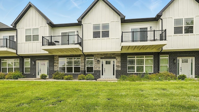 420 Catherwood Dr Unit 3, West Lafayette, IN 47906 - multi unit property with a balcony, board and batten siding, a front lawn, and stone siding