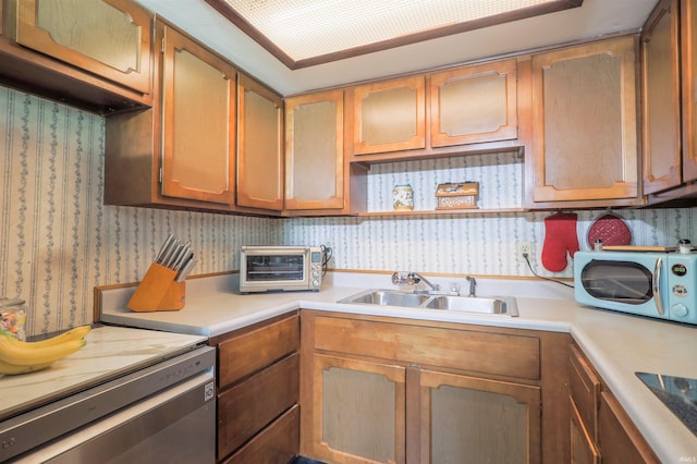 335 E State Road 58, Bedford, IN 47421 - kitchen with light countertops, wallpapered walls, dishwasher, brown cabinets, and black electric stovetop