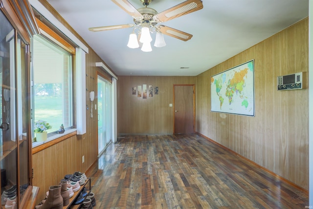 335 E State Road 58, Bedford, IN 47421 - spare room with hardwood / wood-style flooring, a ceiling fan, and wooden walls