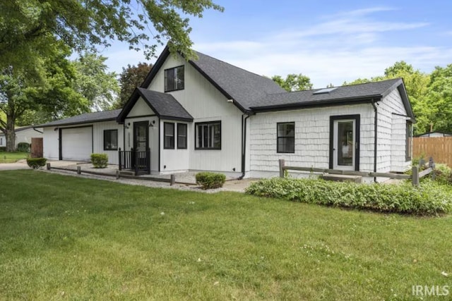 52354 Forestbrook Ave, South Bend, IN 46637 - modern inspired farmhouse with an attached garage, a shingled roof, and concrete driveway