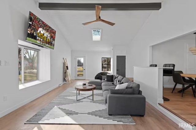 52354 Forestbrook Ave, South Bend, IN 46637 - living area with light wood-style flooring, ceiling fan, beamed ceiling, and high vaulted ceiling