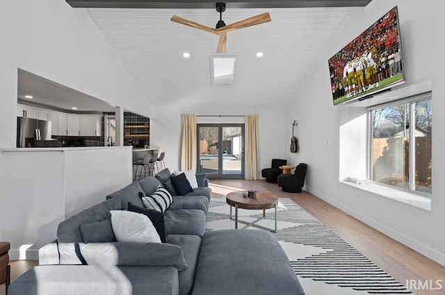 52354 Forestbrook Ave, South Bend, IN 46637 - living room with healthy amount of natural light, ceiling fan, light wood-style flooring, and high vaulted ceiling
