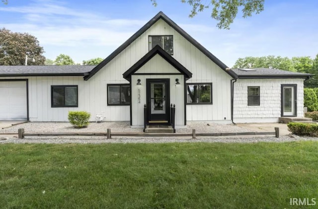 52354 Forestbrook Ave, South Bend, IN 46637 - modern farmhouse style home with a front lawn, board and batten siding, and a garage