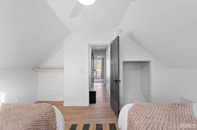 52354 Forestbrook Ave, South Bend, IN 46637 - bedroom featuring wood finished floors, vaulted ceiling, a ceiling fan, and a closet