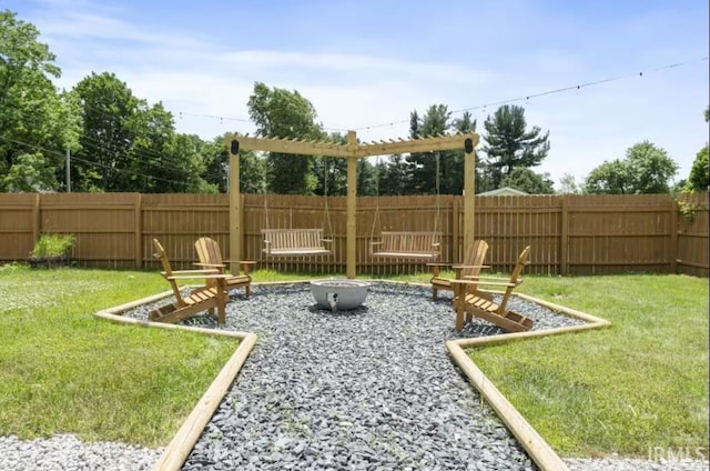 52354 Forestbrook Ave, South Bend, IN 46637 - fenced backyard with a fire pit