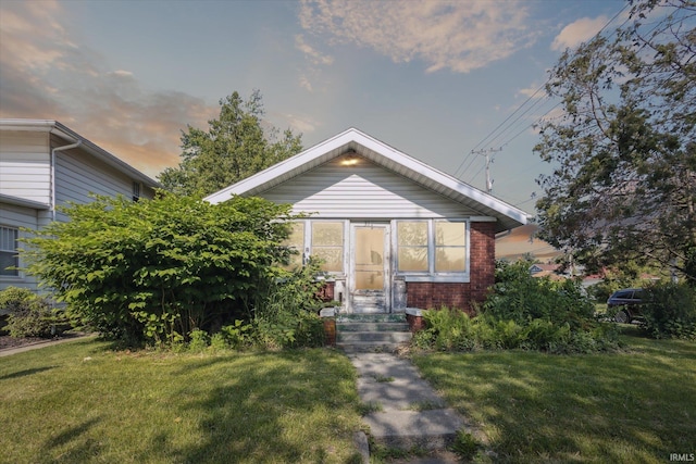 317 N Sunnyside Ave, South Bend, IN 46617 - bungalow-style house with a lawn and brick siding
