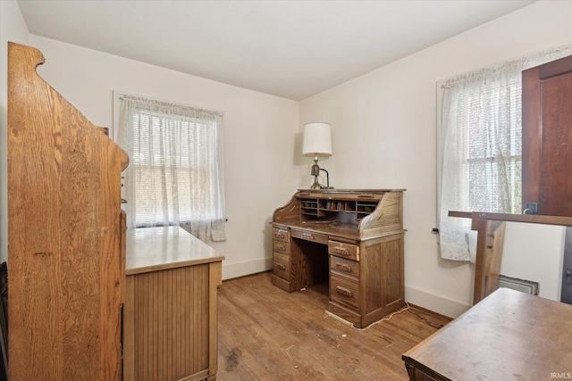 317 N Sunnyside Ave, South Bend, IN 46617 - home office with light wood-style flooring and baseboards