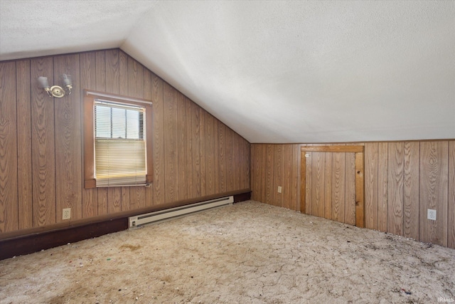 317 N Sunnyside Ave, South Bend, IN 46617 - additional living space with baseboard heating, vaulted ceiling, carpet, a textured ceiling, and wood walls