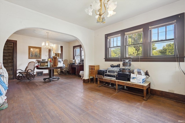 317 N Sunnyside Ave, South Bend, IN 46617 - office with a chandelier, arched walkways, wood finished floors, and healthy amount of natural light