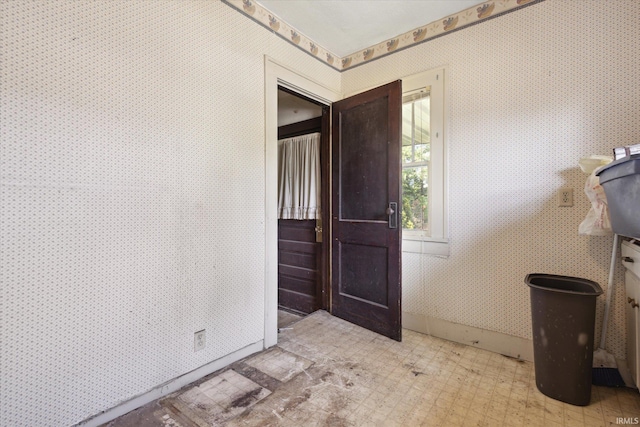 317 N Sunnyside Ave, South Bend, IN 46617 - foyer with wallpapered walls and tile patterned floors
